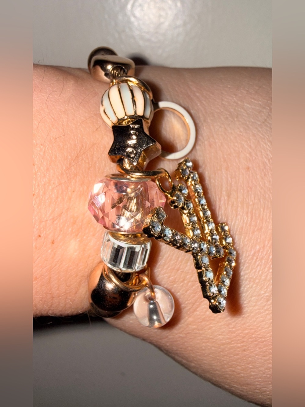 Gold-Tone Pink Crystal Charm Bracelet